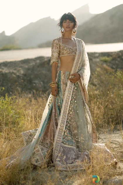 Full length outdoor portrait of pastel bridal lehenga with layered tissue skirt and hand woven lilac pallu