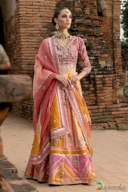 Full length twirl shot showcasing flare of multi color chatta pati lehenga skirt and panel detail