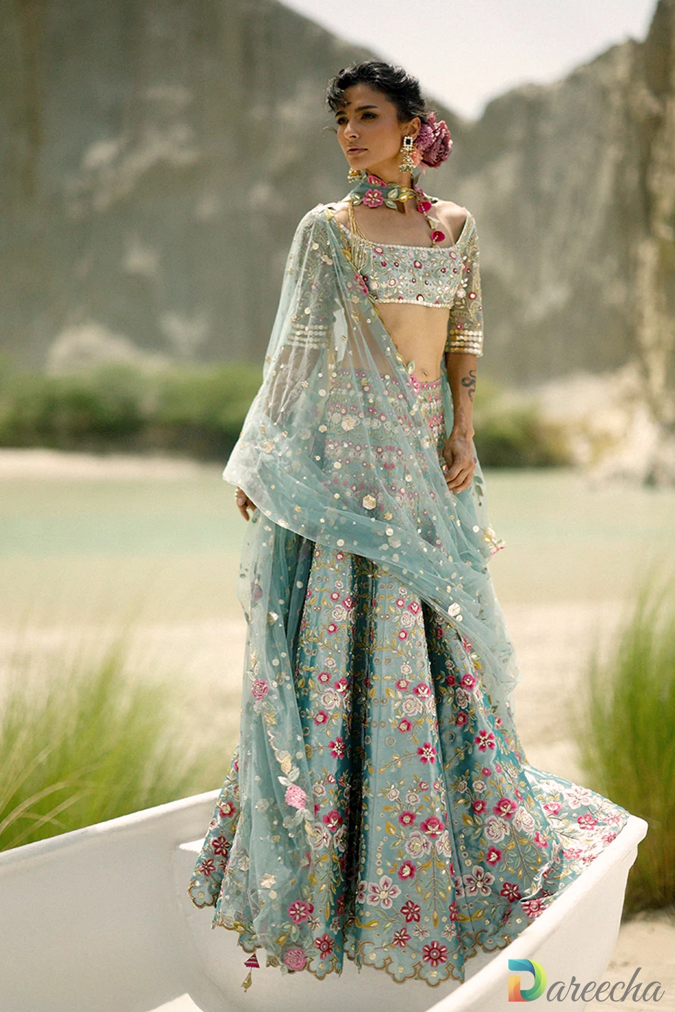 Full length view of ice blue tissue lehenga featuring dense floral jaal and scalloped zardoze hem border