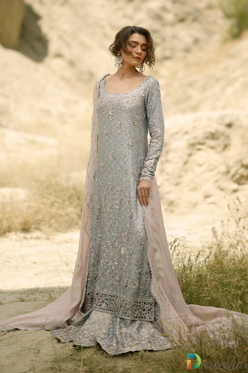 Full length standing portrait of steel blue long shirt with lehenga and blush embroidered cotton net dupatta