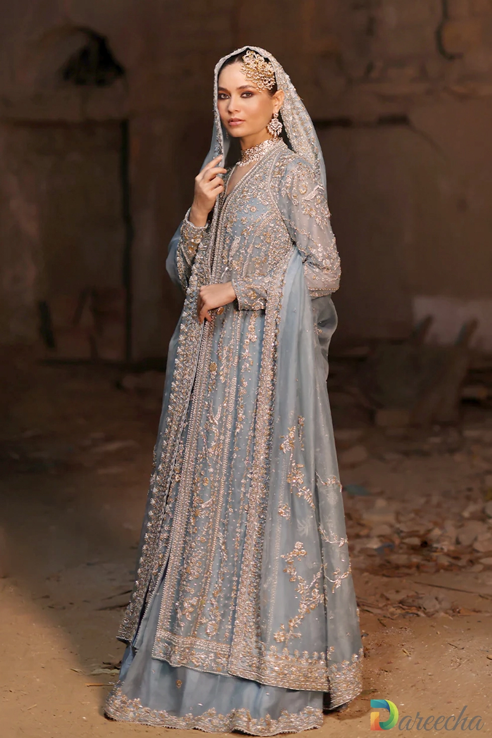 Front view showing open jacket revealing pure raw silk crop top blouse on powder blue lehenga set