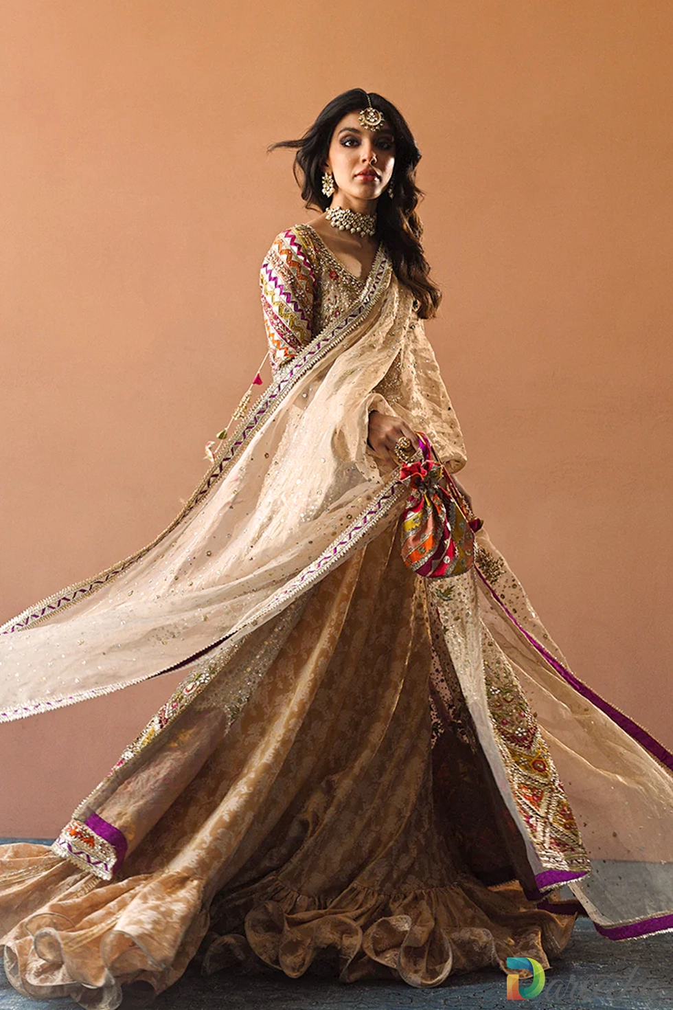 Full length view of bride in copper tissue front open peshwas with ruffled tissue brocade lehenga