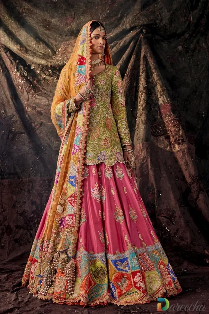 ull length standing view showcasing designer multi color bridal lehenga with rust orange draped odhna[cite: 12]