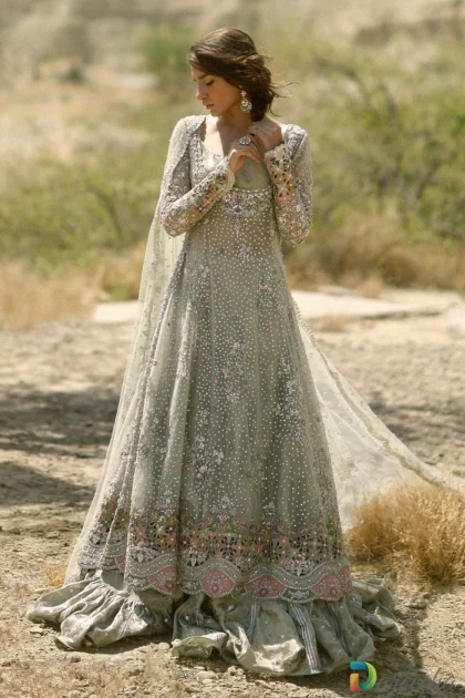 Full length front view of model wearing frosted mint peshwas lehenga with silver zardoze embroidery and tissue brocade ruffled hemline