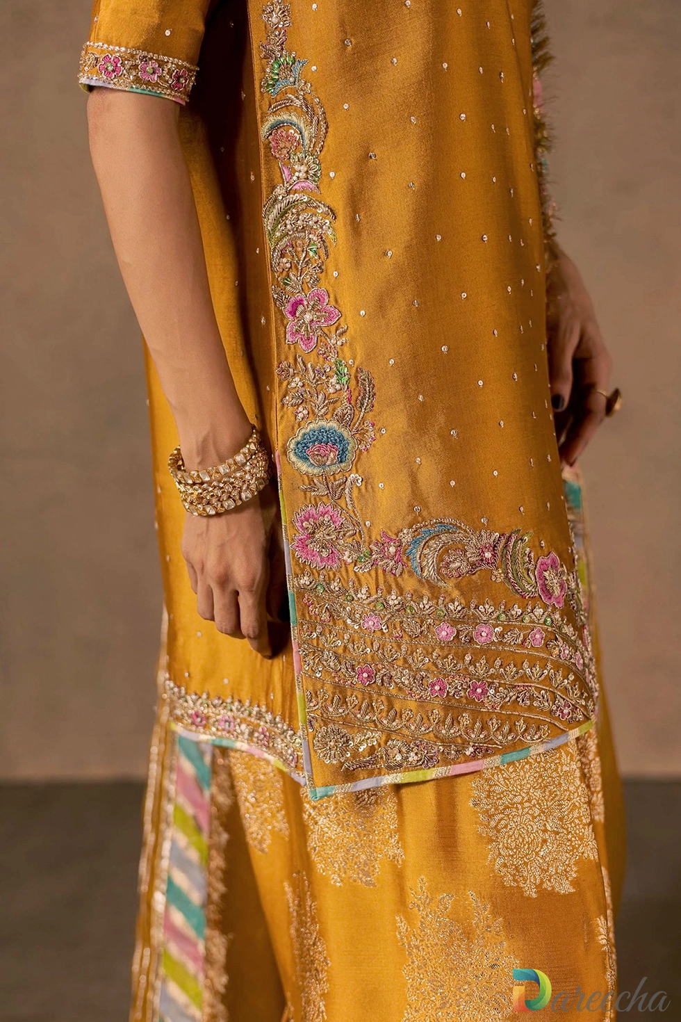 Close up of hem embroidery and multicoloured patti border