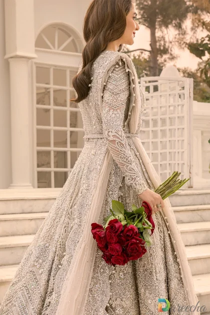 Side angle showing sheer embellished net long sleeves