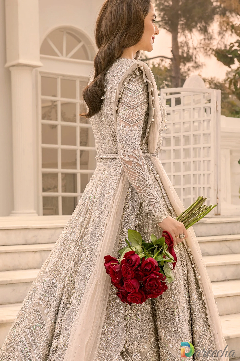 Side angle showing sheer embellished net long sleeves