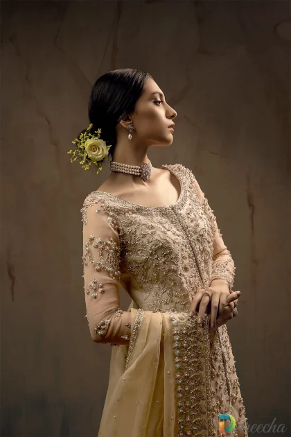 Close-up shot showing hand-embellished zardozi, crystals, and pearl work on front-open organza shirt
