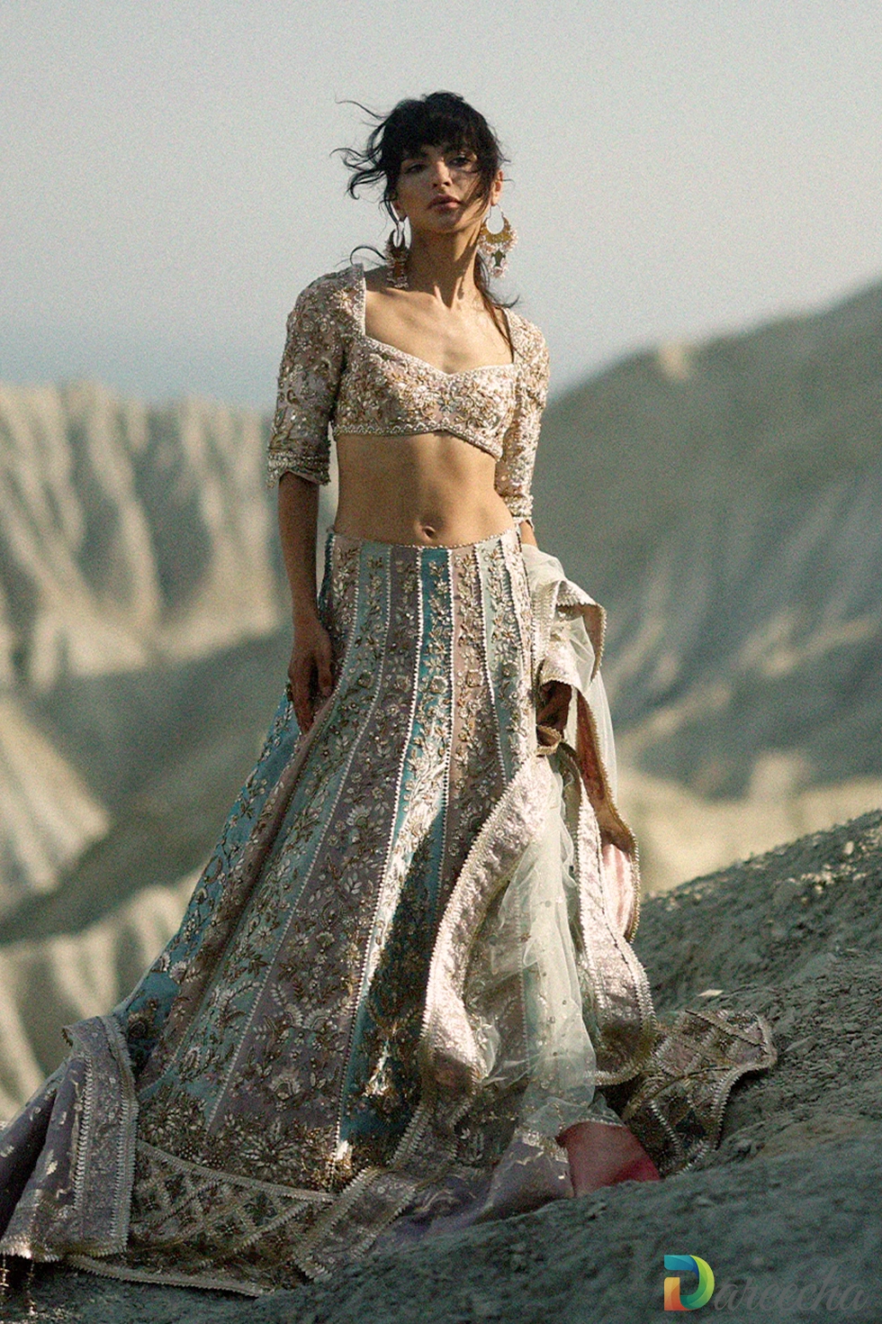 Front view of pastel bridal lehenga with sweetheart neckline choli bodice and voluminous multi panel skirt