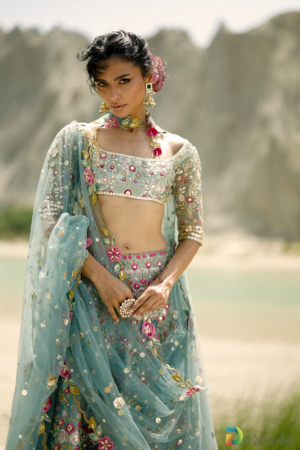 Close up detail of ice blue tissue lehenga showing resham embroidery and scattered gota tulle dupatta