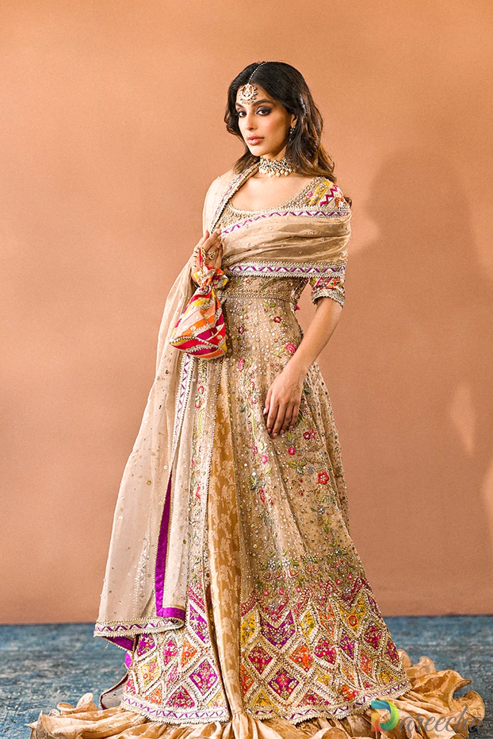 Front view of copper tissue bridal peshwas with chattapatti hem border and matching dupatta
