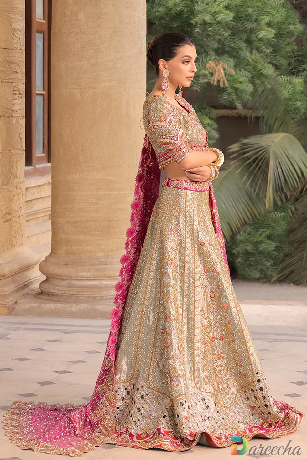 Side profile of celadon tissue hand embroidered lehenga with chatapati cutwork hem and train