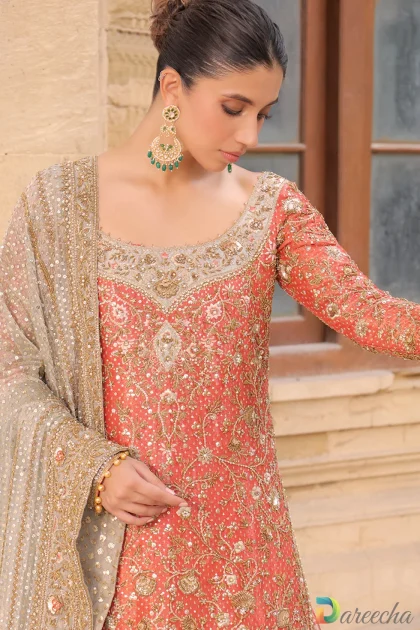 Close up view of bodice detail on coral tissue A line long shirt lehenga with zardoze resham and sequin embroidery