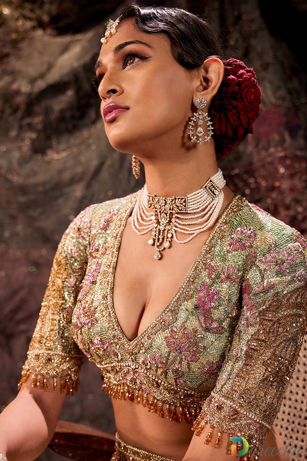 Portrait of model wearing pistachio green lotus motif saree blouse with soft glam makeup