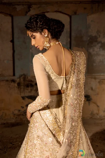 Back scoop neck of ivory organza lehenga choli set