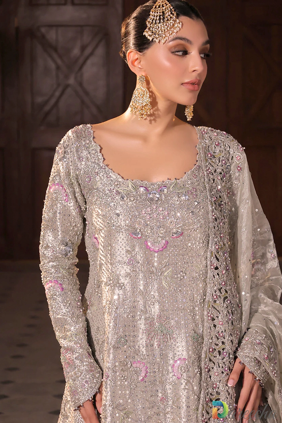 Close up of zardoze cutdana and blush pink resham peacock embroidery on platinum tissue peshwas