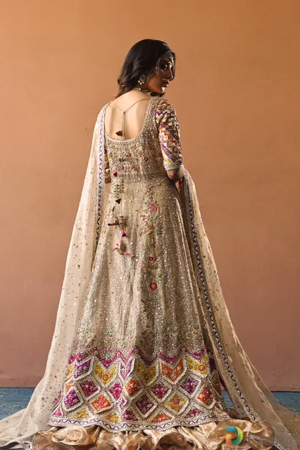 Back view of tissue bridal peshwas featuring deep back cut out with tassel dori details