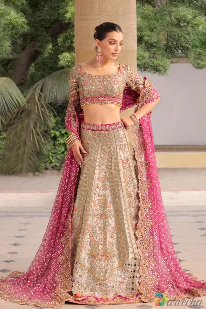 Front view of celadon tissue bridal lehenga with scalloped choli and beaded tassels