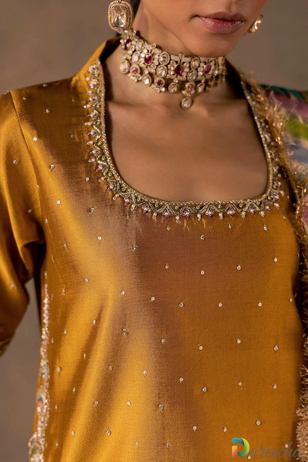 Close up of hem embroidery and multicoloured patti border