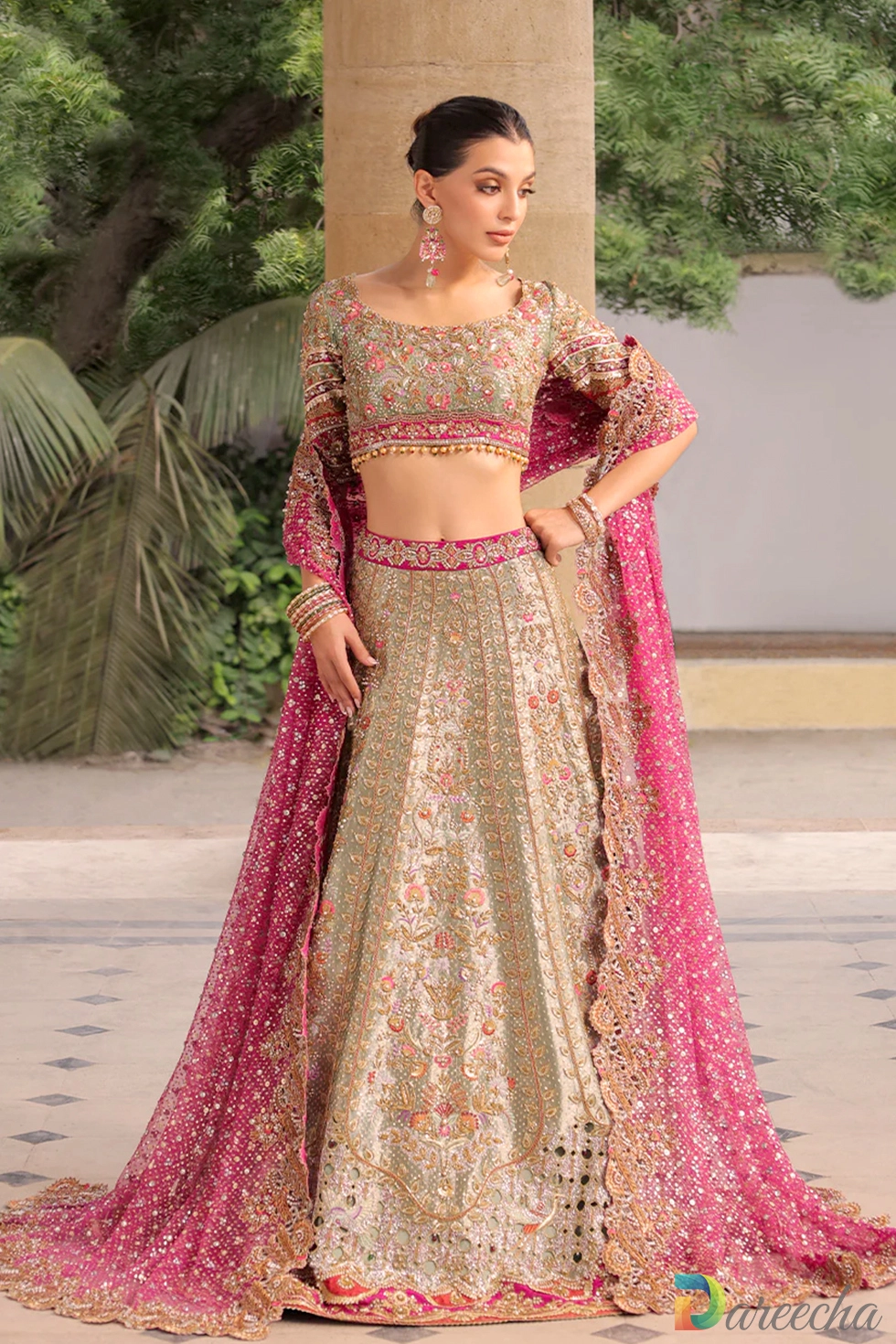 Front view of celadon tissue bridal lehenga with scalloped choli and beaded tassels