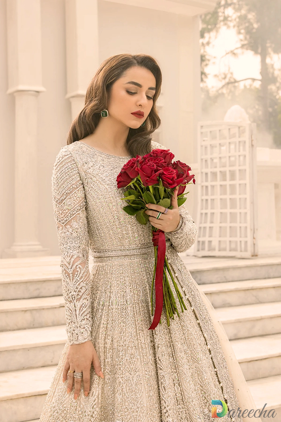 Close up portrait highlighting round neck and adda work
