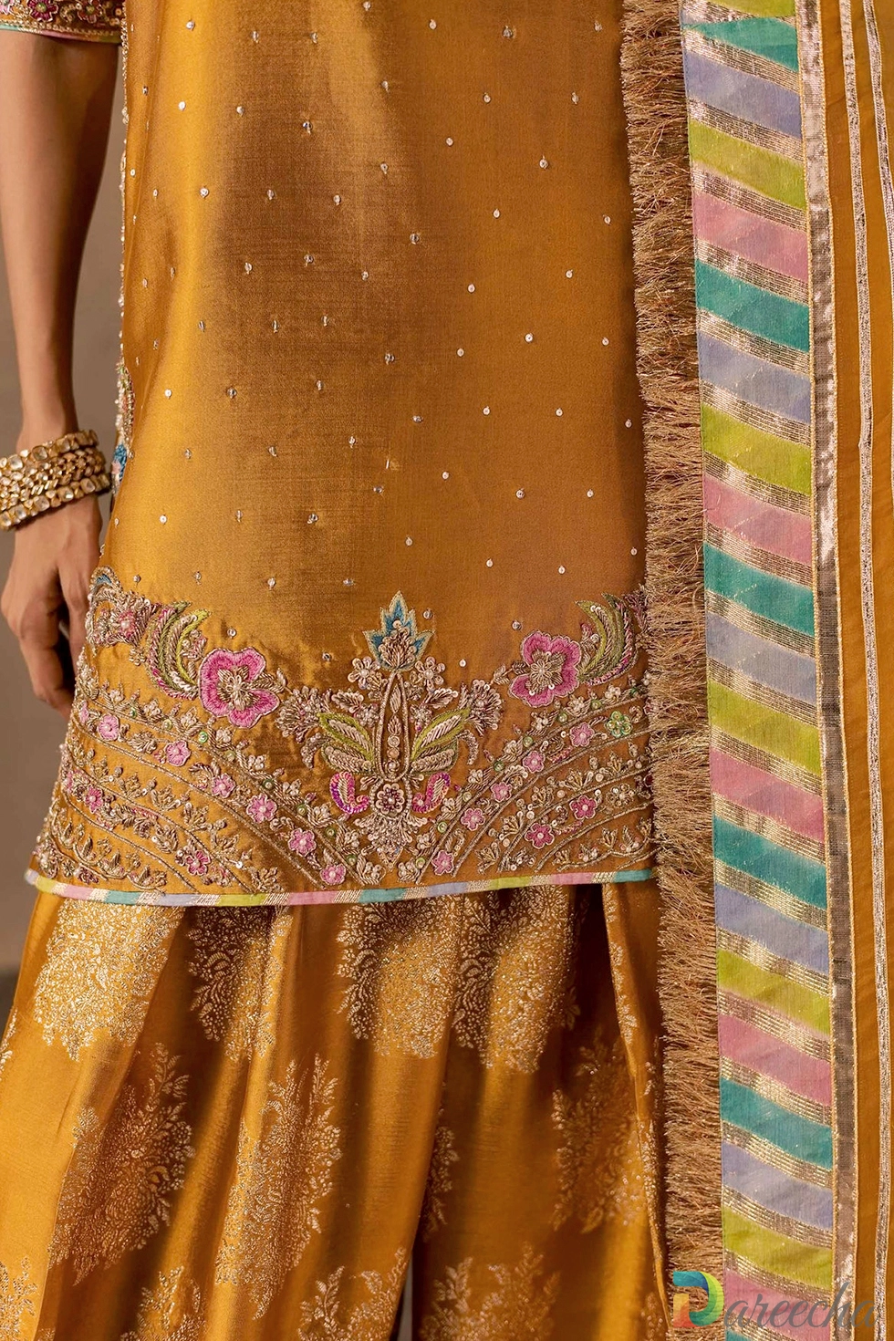 Scoop neckline with zardozi and pearl embellishment