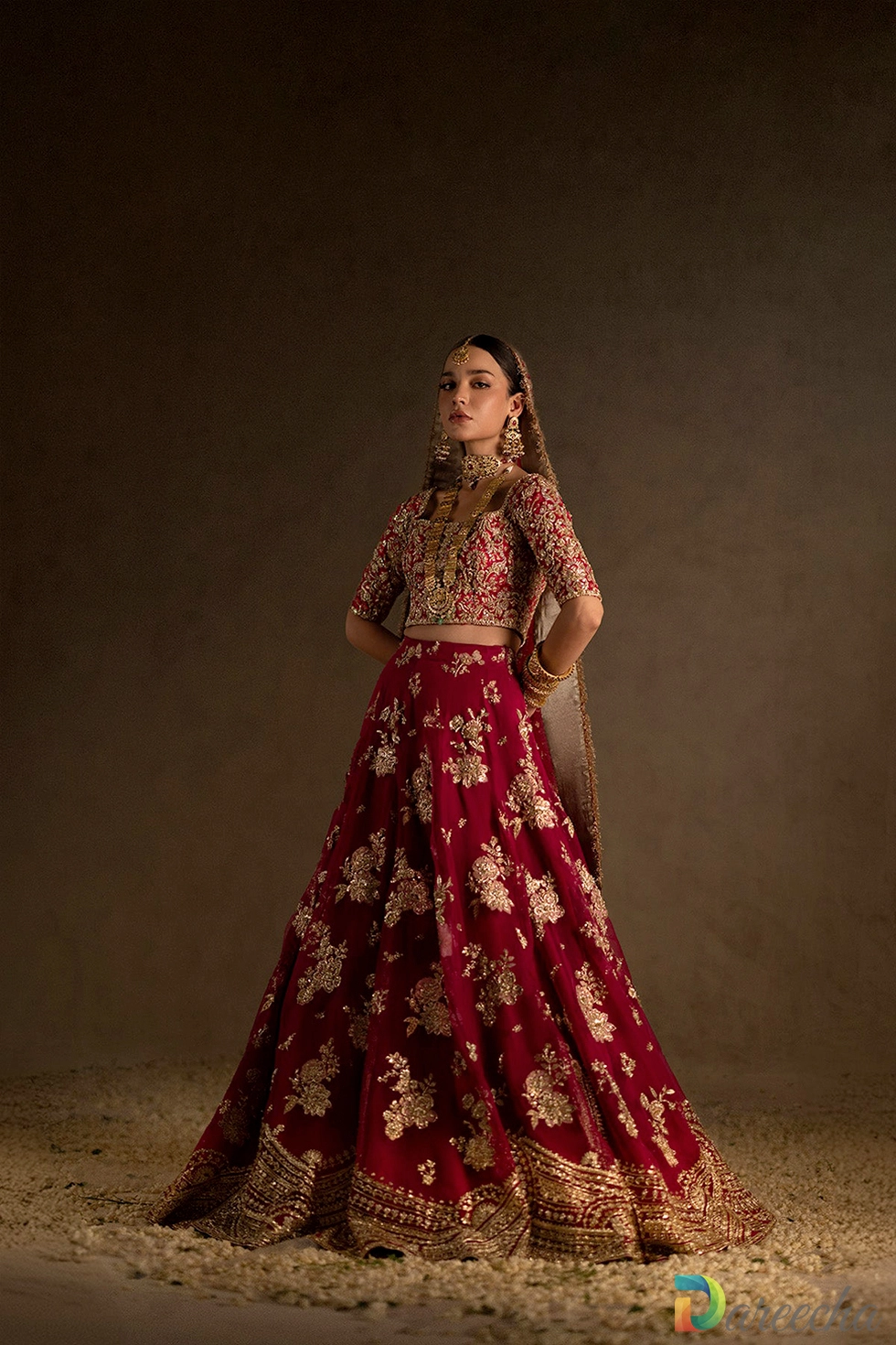 Deep red bridal lehenga with gold zardozi