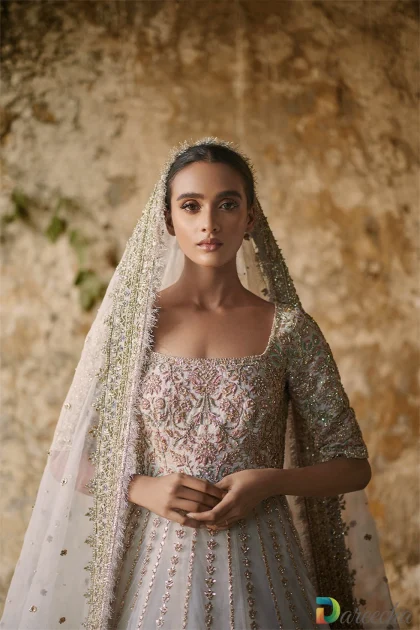 White pishwas with lehenga close up view with zardozi