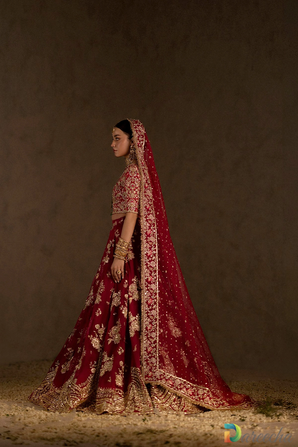 Side profile of marsala pink embroidered outfit