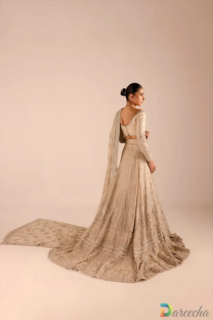 Back view of gold bridal lehenga with train