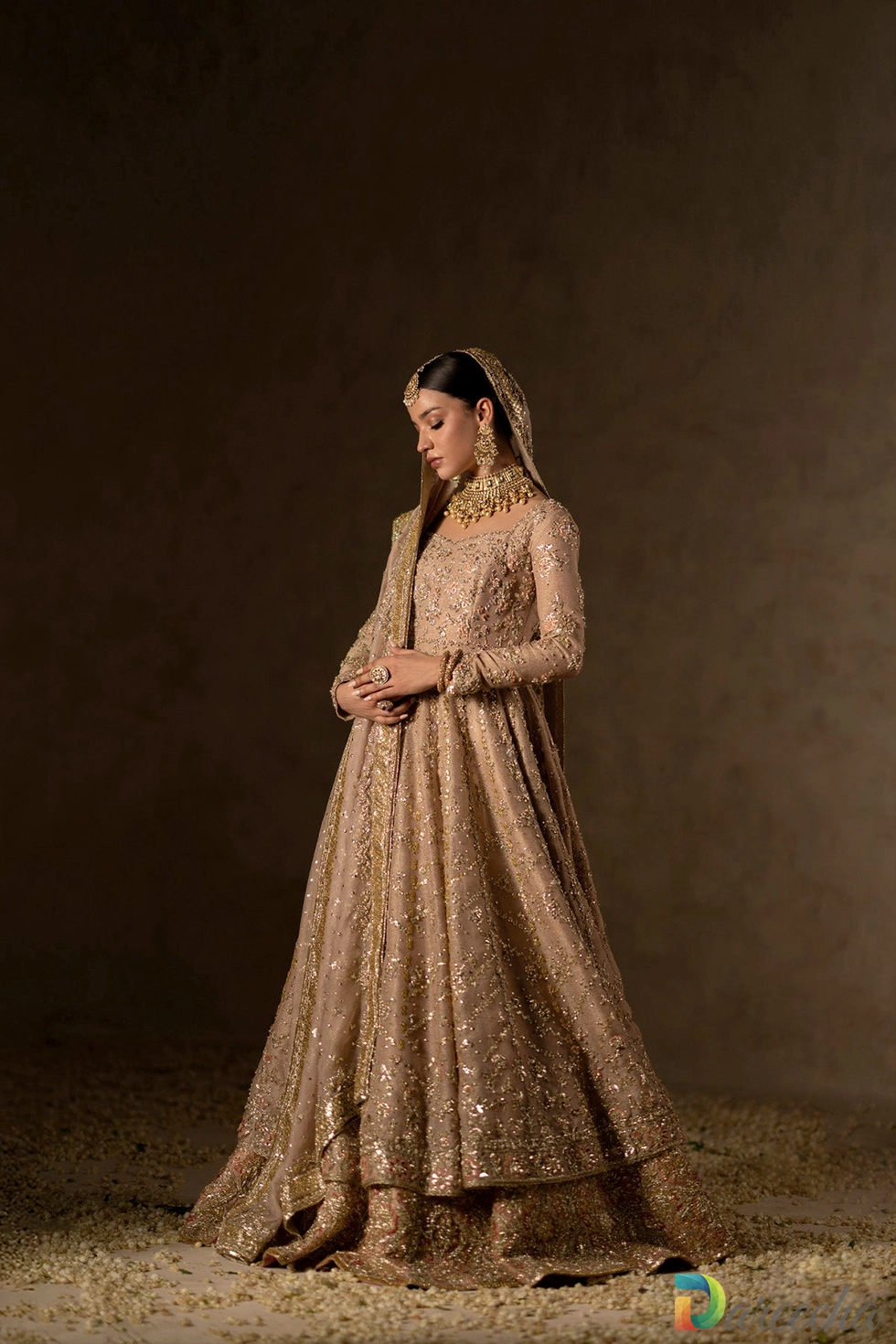 Front view showing flared peshwas and tissue lehenga