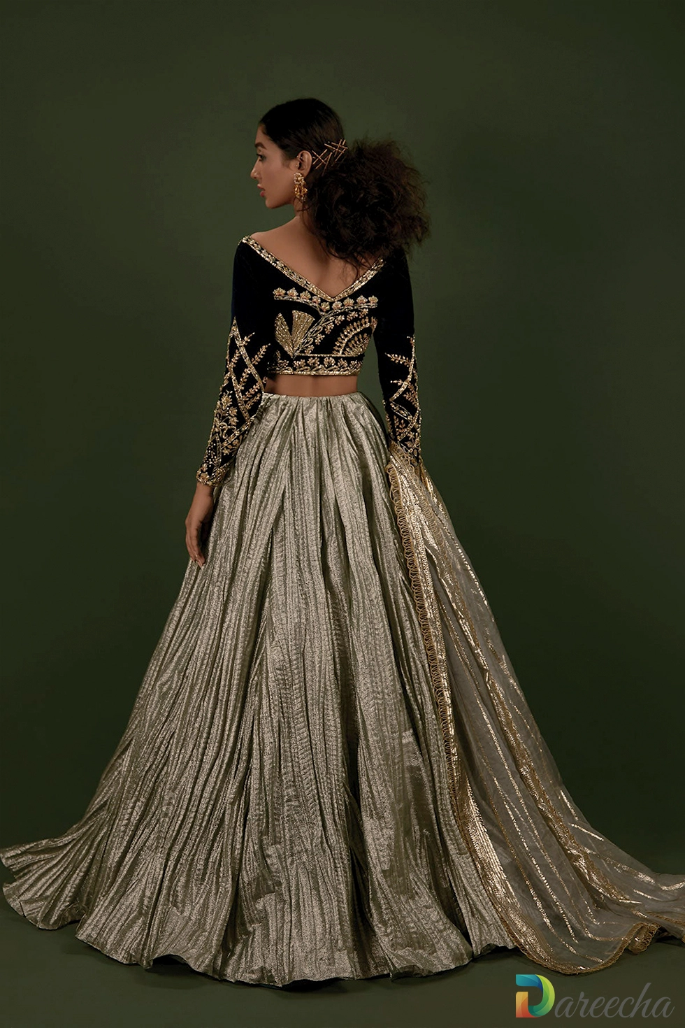 Back view of deep V neck velvet choli and lehenga Back view of deep V neck velvet choli and lehenga