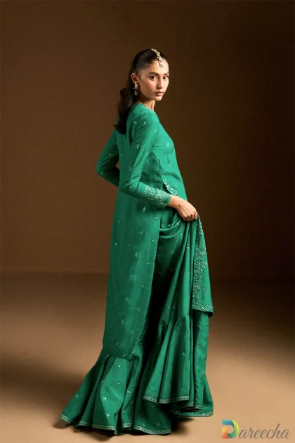 Side profile highlighting long shirt embroidery