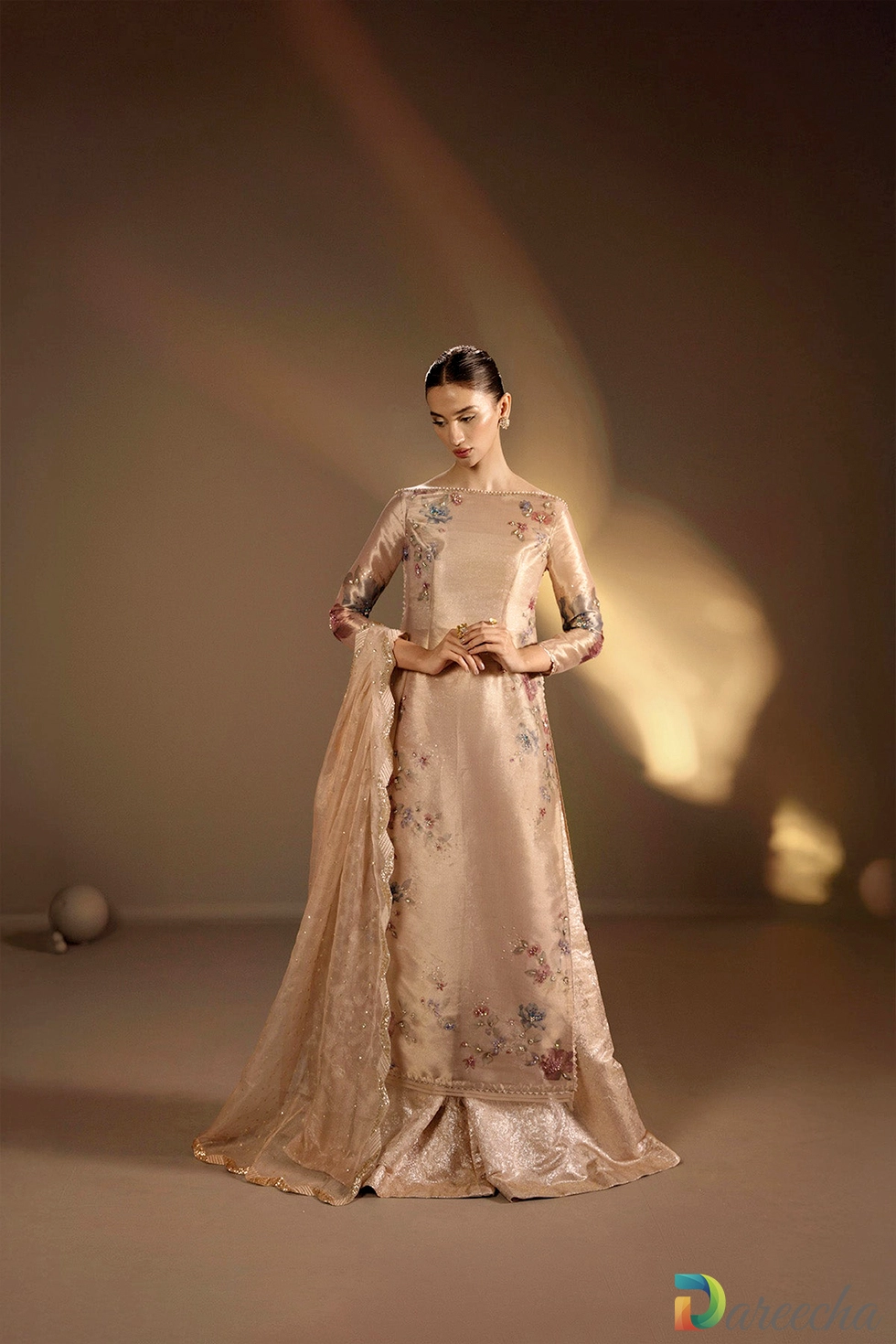 Model posing showing floral tissue shirt and zari dupatta Model posing showing floral tissue shirt and zari dupatta