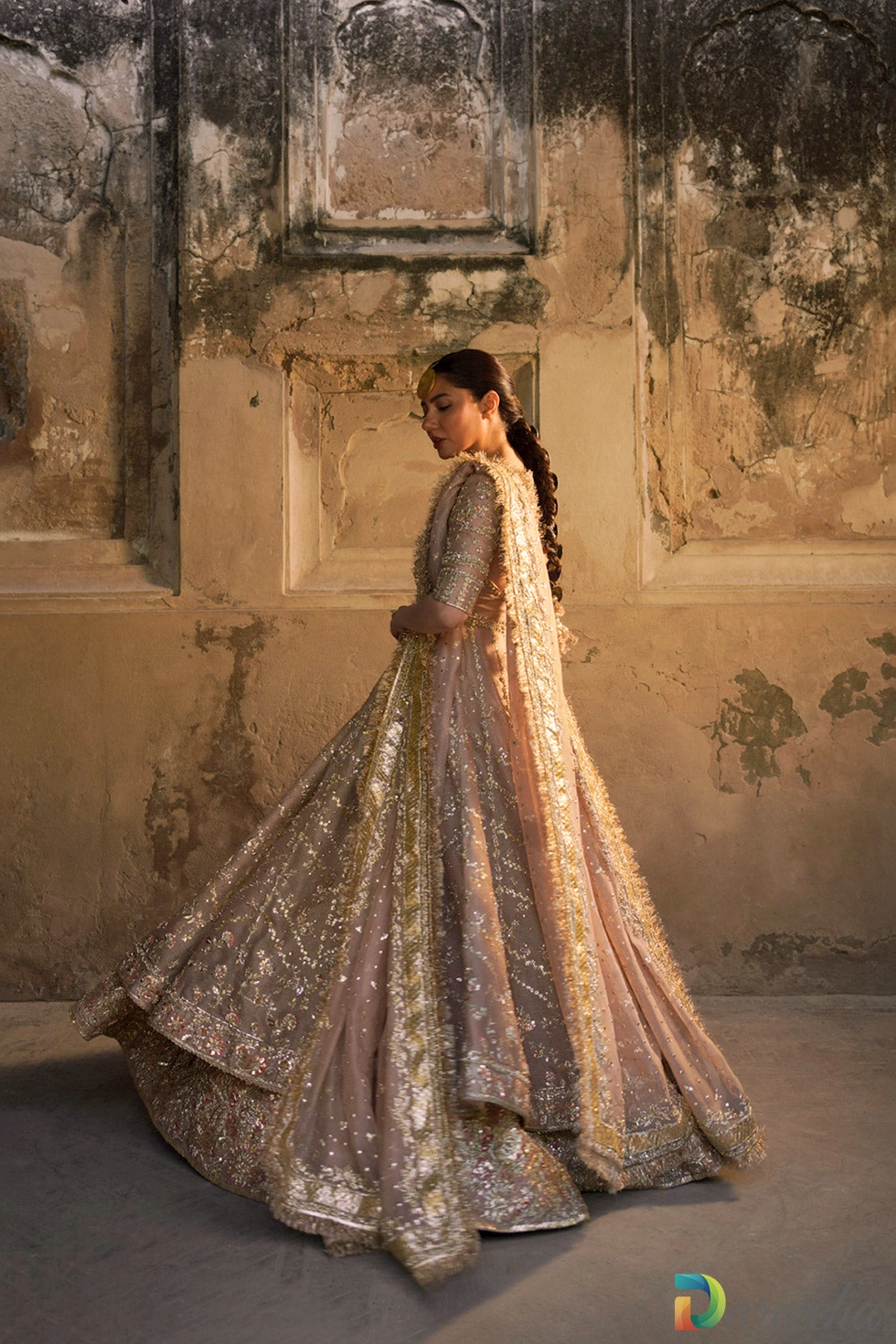 Side profile with trailing masuri veil and sequin spray Side profile with trailing masuri veil and sequin spray