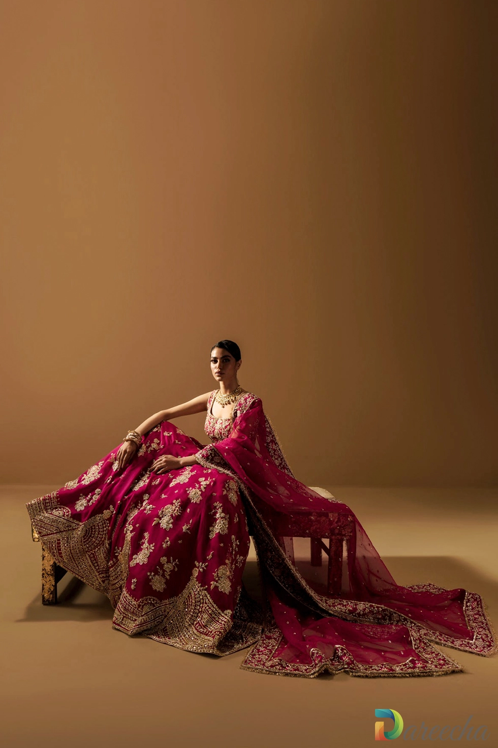 Model seated showing gotta and zardozi hem border