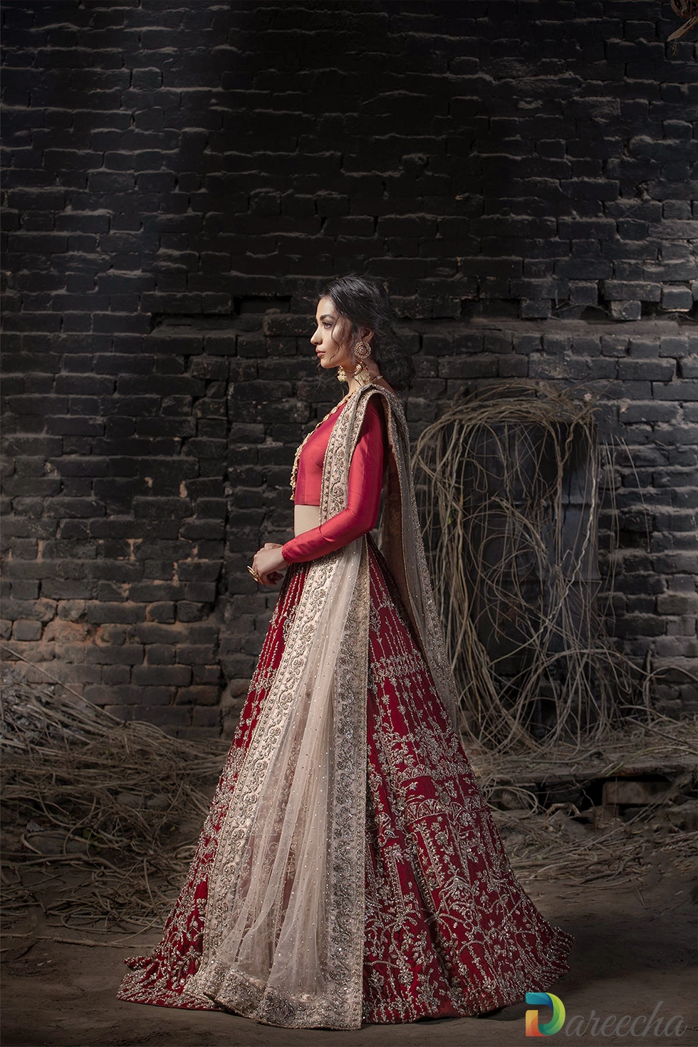 Side view showcasing geometric and floral embroidered skirt