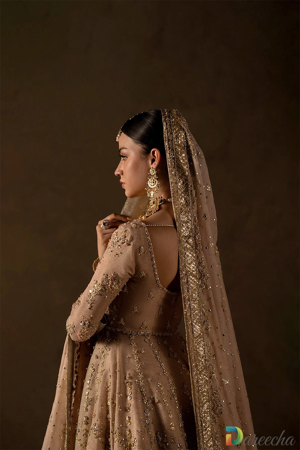 Back view highlighting silk organza dupatta border and sleeve